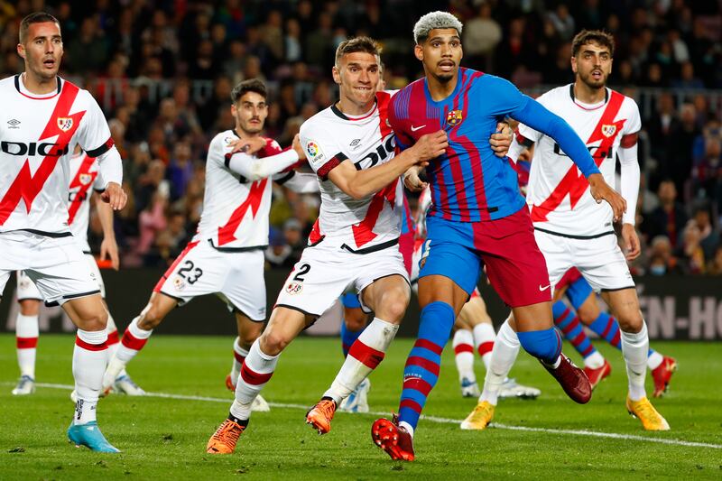 Barcelona's Ronald Araujo, second from right, and Rayo's Nikola Maras challenge for the ball. AP Photo 