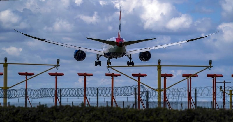 A plane lands at London's Heathrow Airport as travel restrictions gradually ease. AP