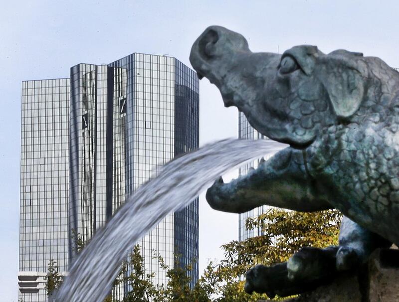 Deutsche Bank’s headquarters in Frankfurt, Germany. Deutsche Bank defied expectations on Thursday by posting a small profit versus an antici­pated net loss for the third quarter. Michael Probst / AP Photo