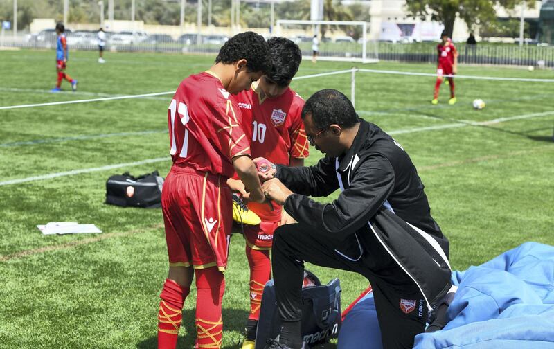 Abu Dhabi, United Arab Emirates - Boys from the Bahrain National team are attended for bruises at Abu Dhabi World Cup Day 1, Zayed Sports City. Khushnum Bhandari for The National