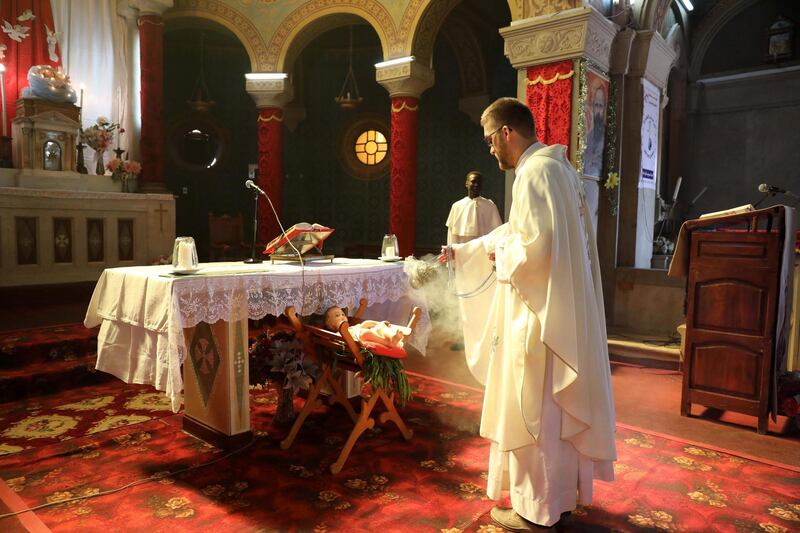 A priest leads a Christmas Mass at St. Matthew's Cathedral Church in Khartoum.