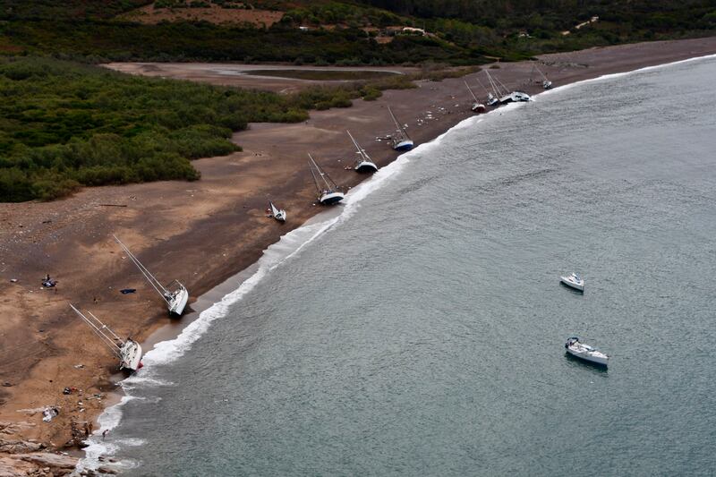 Boats are washed ashore after a storm in Crovani bay on the island of Corsica. Marine Nationale via AP