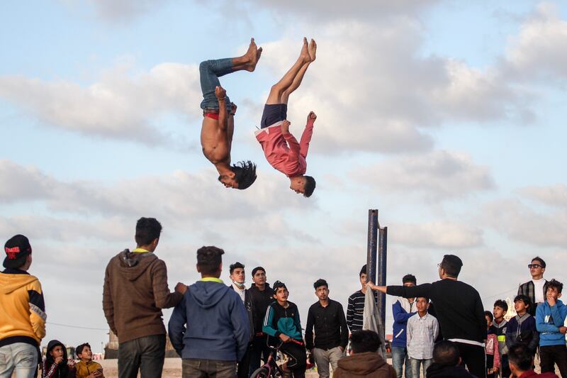 Palestinian youths practise parkour skills on Gaza Beach during sunset, on February 12. Those aged 18 to 24 in Gaza and the West Bank were polled for the 2021 Arab Youth Survey. Photo: Sameh Rahmi / NurPhoto