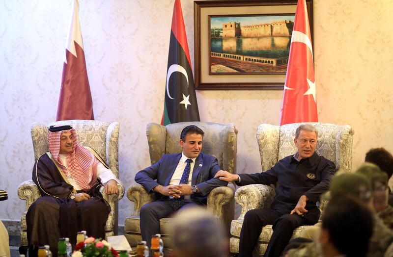 Turkish Defence Minister Hulusi Akar talks with Deputy Defence Minister of Libya's internationally recognised Government of National Accord (GNA) Salahedin al-Namroush and Qatar's Defense Minister Dr. Khalid bin Mohamed Al Attiyah in Tripoli, Libya, August 17, 2020. Turkish Defence Ministry/Handout via REUTERS ATTENTION EDITORS - THIS PICTURE WAS PROVIDED BY A THIRD PARTY. NO RESALES. NO ARCHIVE.