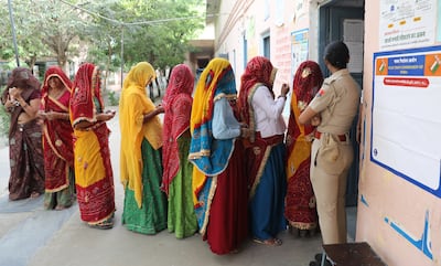 People queue at a polling station to cast their votes in the first phase of the general elections in Kotputli village in Rajasthan, India. EPA