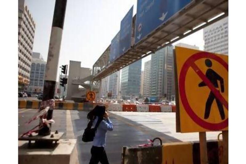 A reader calls for the lifts on the pedestrian bridge outside Abu Dhabi Mall to be fixed. Silvia Razgova / The National