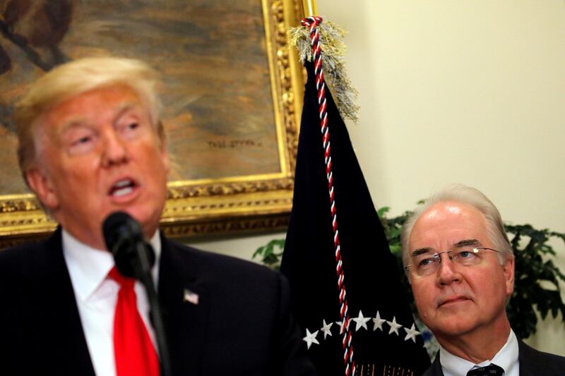 FILE PHOTO: Secretary of Health and Human Services Tom Price (R) looks at U.S. President Donald Trump during a "Made in America" event about pharmaceutical glass manufacturing at the Roosevelt Room of the White House in Washington, U.S., July 20, 2017. REUTERS/Carlos Barria/Files