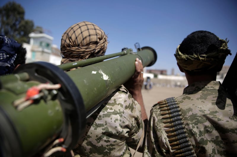 A Houthi rebel fighter holds his a weapon during a gathering aimed at mobilizing more fighters for the Iranian-backed Houthi movement, in Sanaa, Yemen, Thursday, Feb. 20, 2020. The Houthi rebels control the capital, Sanaa, and much of the countryâ€™s north, where most of the population lives. They are at war with a U.S.-backed, Saudi-led coalition fighting on behalf of the internationally recognized government. (AP Photo/Hani Mohammed)