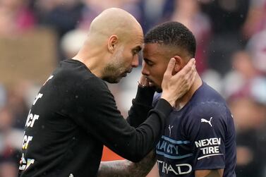 Manchester City's head coach Pep Guardiola, left, interacts with player Gabriel Jesus at the end of the English Premier League soccer match between West Ham United and Manchester City at London stadium in London, Sunday, May 15, 2022.  (AP Photo / Kirsty Wigglesworth)