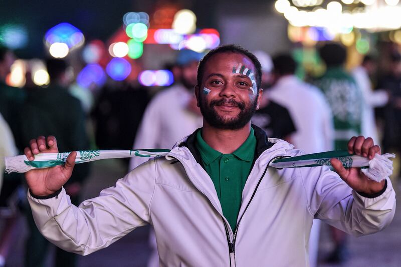 A fan with face paint poses during celebrations in Riyadh. AFP