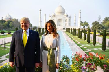 US President Donald Trump and First Lady Melania Trump pose as they visit the Taj Mahal in Agra. AFP