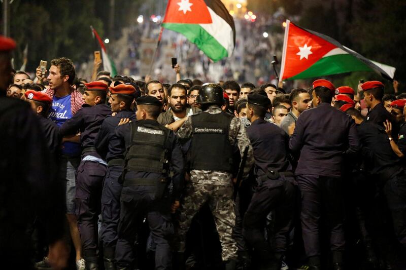 Police officers secure the office of Jordan's prime minister in Amman. Muhammad Hamed / Reuters