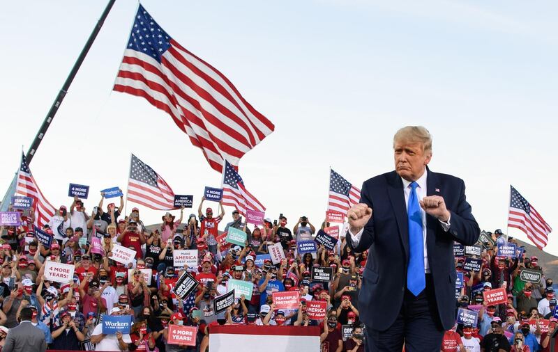 US President Donald Trump dances at the end of a rally at Carson City Airport in Carson City. AFP