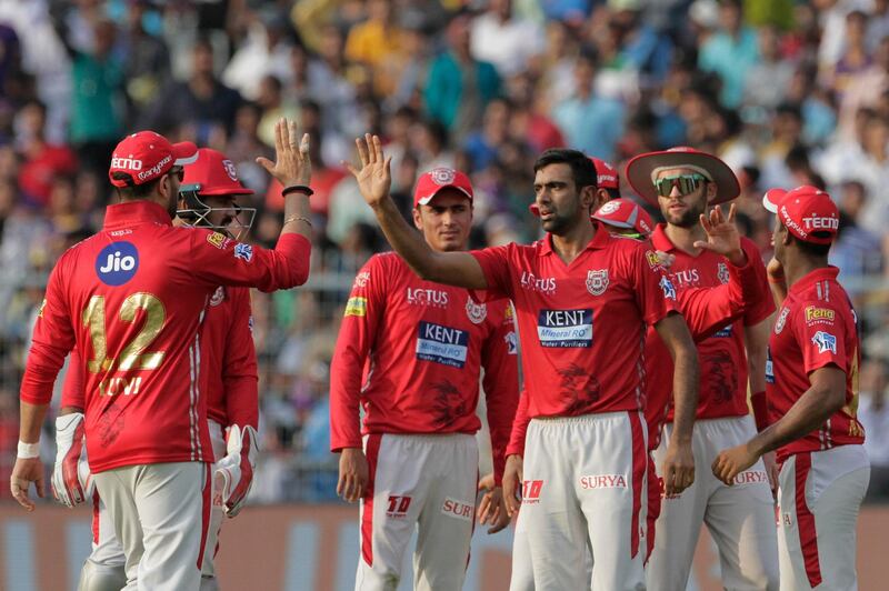 Kings XI Punjab's Ravichandran Ashwin, without cap, celebrate thes with teammates dismissal of Kolkata Knight Riders' Robin Uthappa during the VIVO IPL cricket T20 match in Kolkata, India, Saturday, April 21, 2018. (AP Photo/Bikas Das)