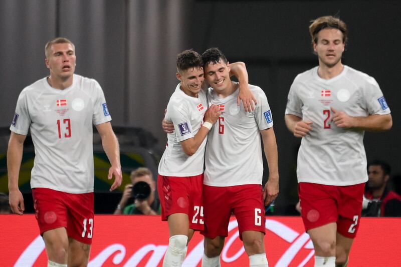 Denmark's Andreas Christensen celebrates with teammates after levelling at 1-1. AFP