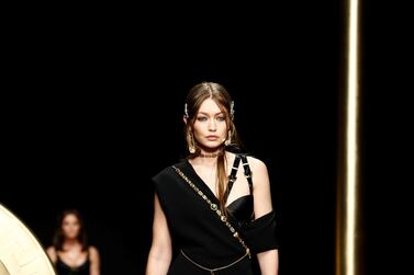 Model Gigi Hadid presents a creation by Versace during the Milan Fashion Week. Reuters 