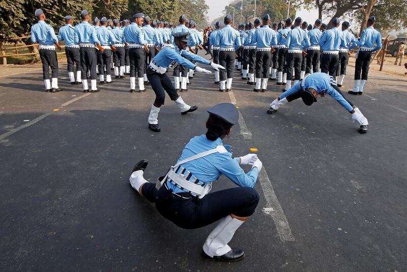 Indian Air Force officers stretch before the full rigours of a full dress rehearsal. Rupak de Chowdhuri / Reuters