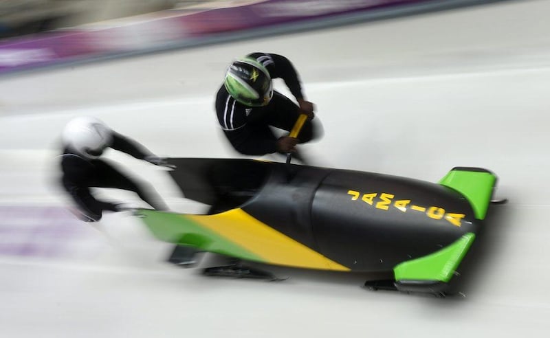 Pilot Winston Watts of Jamaica and his push athlete Marvin Dixon at the start of their run in the men's two-man bobsleigh training session on Friday. Tobias Hase / EPA 