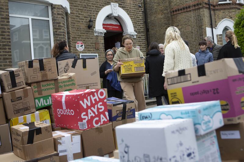 Volunteers prepare to load a van with donations for Ukrainian refugees at the Lewisham Polish Centre.