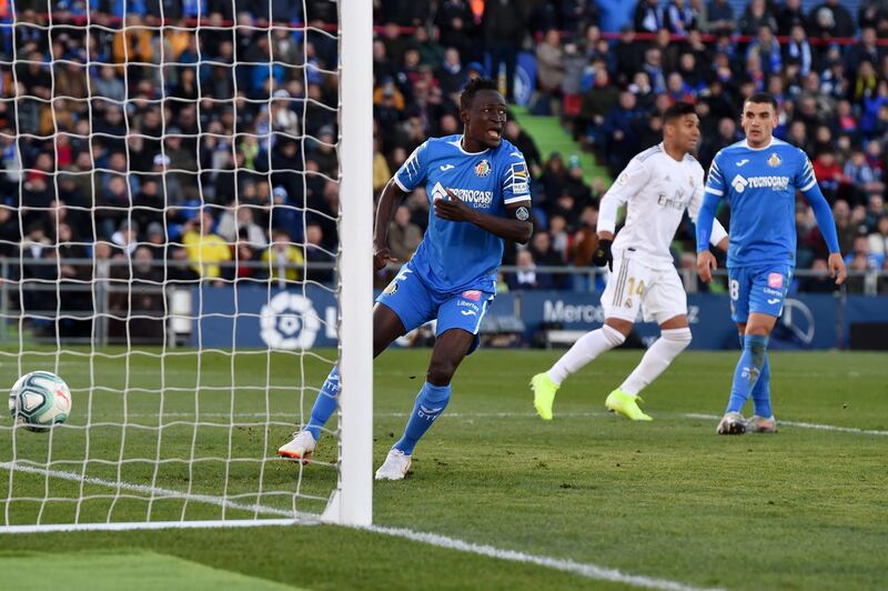 Djene Dakonam of Getafe reacts after Real Madrid's first goal. Getty Images