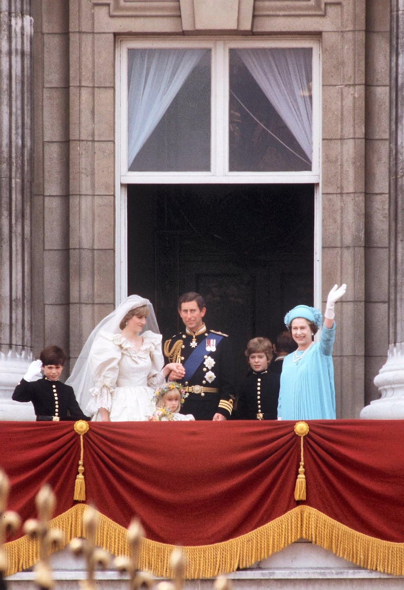 LONDON, UNITED KINGDOM - JULY 29:  The Queen On The Balcony Of Buckingham Palace With The Prince And Princess Of Wales On Their Wedding Day With Their Pageboys Lord Nicholas Windsor And Edward Van Cutsem, And One Of Their Bridesmaids Clementine Hambro  (Photo by Tim Graham Photo Library via Getty Images)