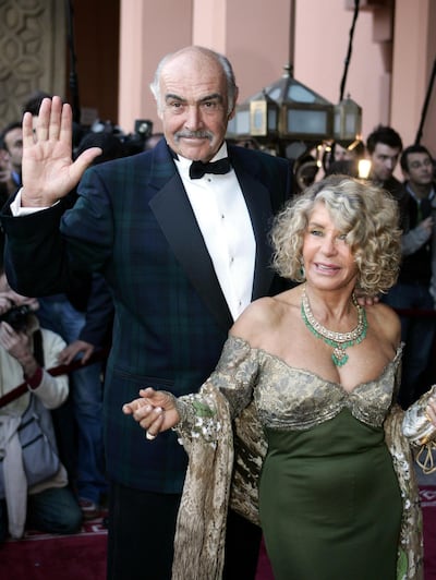 (FILES) In this file photo taken on December 07, 2004 British actor Sean Connery and his wife, Micheline Roquebrune, arrive for the presentation of "Alexendre," directed by Oliver Stone, during the 44th International Film Festival in Marrakesh. Legendary British actor Sean Connery, best known for playing fictional spy James Bond in seven films, has died aged 90, his family told the BBC on on October 31, 2020. The Scottish actor, who was knighted in 2000, won numerous awards during his decades-spanning career, including an Oscar, three Golden Globes and two Bafta awards.
 / AFP / Jack GUEZ
