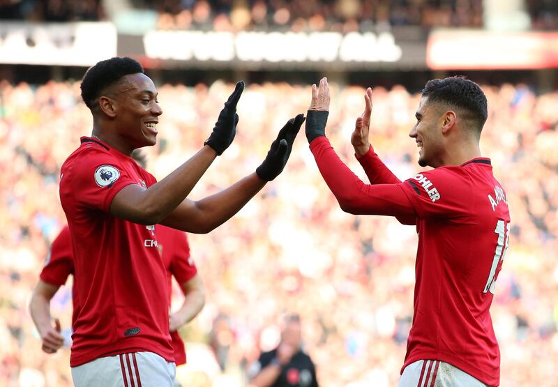 Andreas Pereira celebrates with Anthony Martial after scoring his team's first goal on Sunday. Getty Images