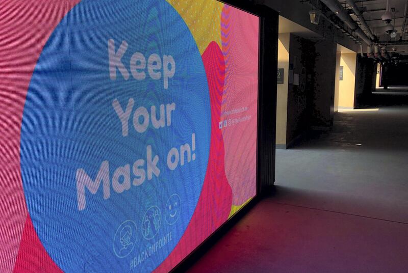 Dubai, United Arab Emirates - Reporter: N/A. Covid-19/Coronavirus. A big sign tells people to keep their masks on at The Pointe on the Palm. Tuesday, August 4th, 2020. Dubai. Chris Whiteoak / The National