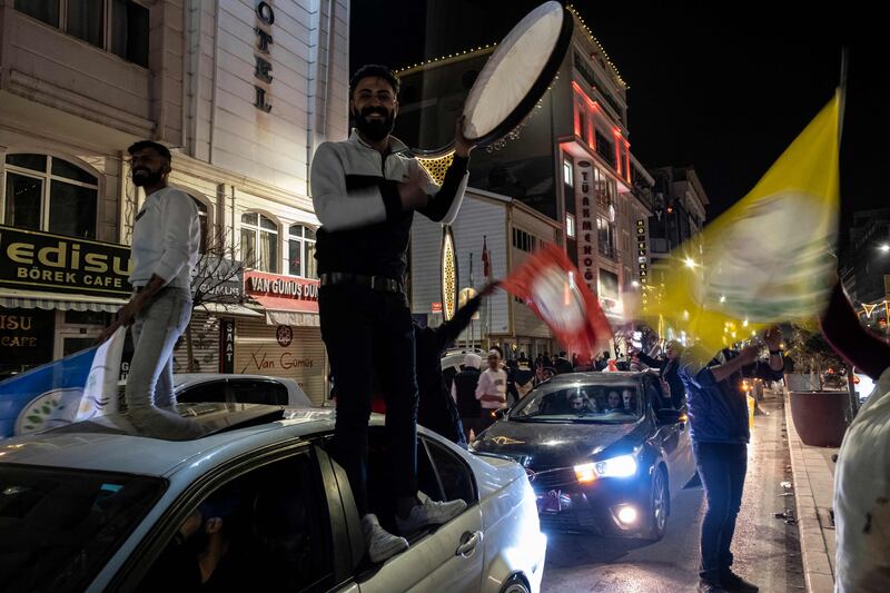 Supporters of the pro-Kurdish DEM party celebrate after officials reinstated municipal election winner Abdullah Zeydan in Van, Turkey. AFP