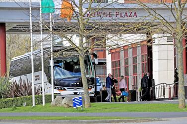 Airline passengers arrivig in Dublin leave the bus to enter the Crowne Plaza hotel to begin their period of quarantine (Photo: Donall Farmer/Getty Images)