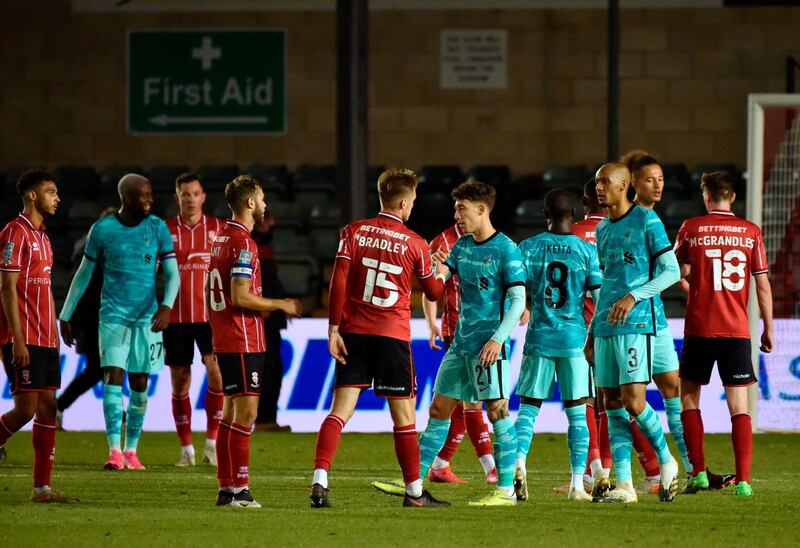 Players of Lincoln City and Liverpool after their League Cup third round clash. EPA