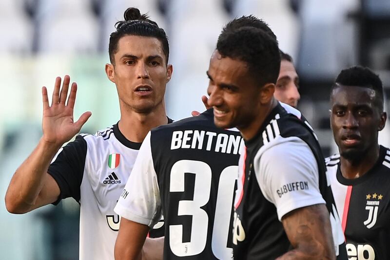Juventus star forward Cristiano Ronaldo (L) celebrates with teammates at the end of the Serie A match against Torino. AFP