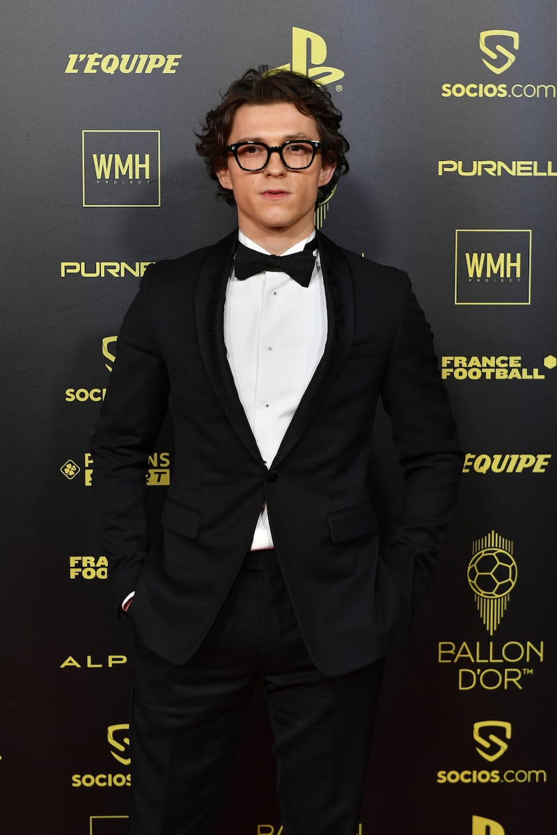 Tom Holland, in a black tuxedo, attends the Ballon D'Or photocall at Theatre du Chatelet on November 29, 2021 in Paris. Getty Images