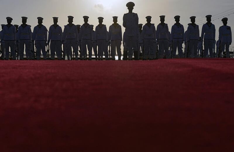 Sri Lankan navy personnel stand guard during a ceremony commissioning two naval patrol boats Japan gifted to the the country's coastguard, in Colombo. AFP