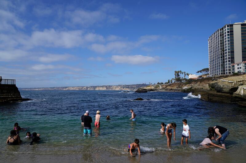 13. Visitors line a beach in San Diego. The US city is the 13th best city destination for families in 2022. AP Photo / Gregory Bull