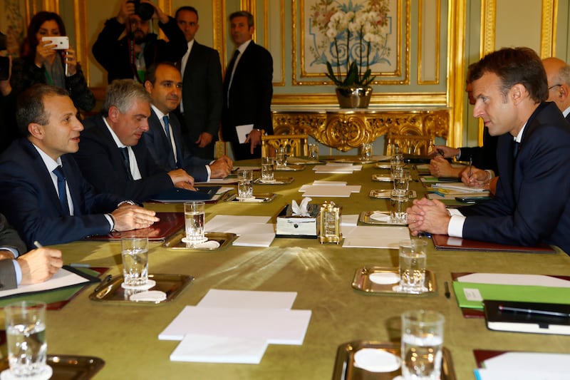 epa06328845 Lebanese Foreign Minister Gebran Bassil, (L), and French President Emmanuel Macron, (R), attend a meeting at the Elysee Palace, in Paris, France, 14 November 2017. Media reports on 14 November 2017 state that Lebanon's Prime Minister Saad Hariri will return  to Lebanon in the coming days in to formally submit his resignation.  EPA/Francois Mori / POOL MAXPPP OUT