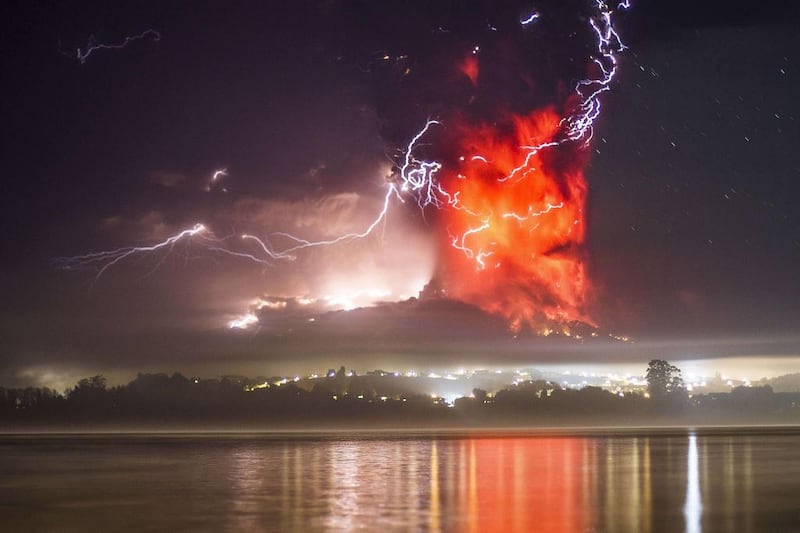 This view from Puerto Varas, southern Chile, shows a high column of ash and lava spewing from the Calbuco volcano. David Cortes Serey / AFP Photo