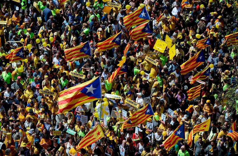 Thousands of people marched in Barcelona on Sunday to protest the jailing of nine Catalan separatist leaders facing trial on rebellion charges. AFP/Josep LAGO