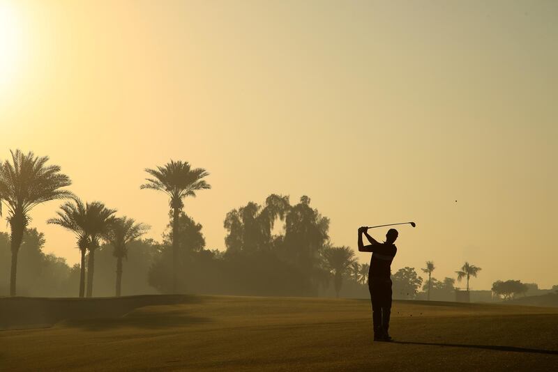 DUBAI, UNITED ARAB EMIRATES - JANUARY 28: Ashley Chesters of England plays his second shot on the third during Day One of the Omega Dubai Desert Classic at Emirates Golf Club on January 28, 2021 in Dubai, United Arab Emirates. (Photo by Andrew Redington/Getty Images)