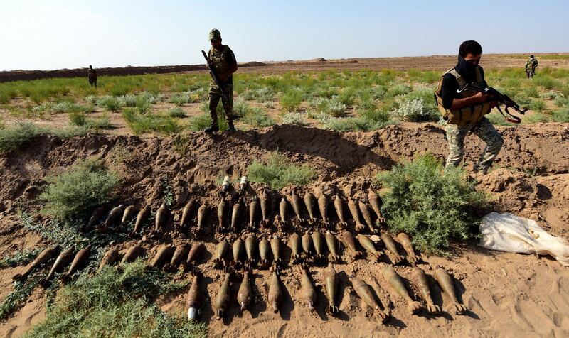 Members of Iraqi Shiite popular mobilization forces display ammunition that was confiscated from ISIS fighters during a military operation in southern Samara city, north of Baghdad, Iraq. EPA