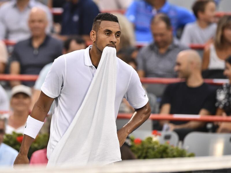 MONTREAL, QC - AUGUST 06: Nick Kyrgios of Australia holds his towel in his mouth against Kyle Edmund of Great Britain during day 5 of the Rogers Cup at IGA Stadium on August 6, 2019 in Montreal, Quebec, Canada.   Minas Panagiotakis/Getty Images/AFP
== FOR NEWSPAPERS, INTERNET, TELCOS & TELEVISION USE ONLY ==
