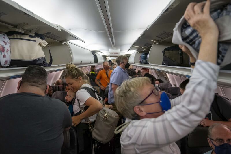 Passengers on a packed flight land at Portland airport, Oregon. Staffing shortages and other issues have led to historic levels of disruptions in the US and Europe. AFP