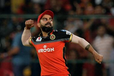 (FILES) In this file photo taken on April 25, 2019 Royal Challengers Bangalore captain Virat Kohli celebrates the dismissal of Kings XI Punjab captain and batsman Ravichandran Ashwin during the 2019 Indian Premier League (IPL) Twenty20 cricket match between Royal Challengers Bangalore and Kings XI Punjab at The M. Chinnaswamy Stadium in Bangalore. Kohli says he has never felt so "calm" going into an Indian Premier League season as the Royal Challengers Bangalore skipper chases an elusive title in the Twenty20 tournament, starting September 19, 2020, in the United Arab Emirates. - IMAGE RESTRICTED TO EDITORIAL USE - STRICTLY NO COMMERCIAL USE / AFP / Manjunath KIRAN / IMAGE RESTRICTED TO EDITORIAL USE - STRICTLY NO COMMERCIAL USE