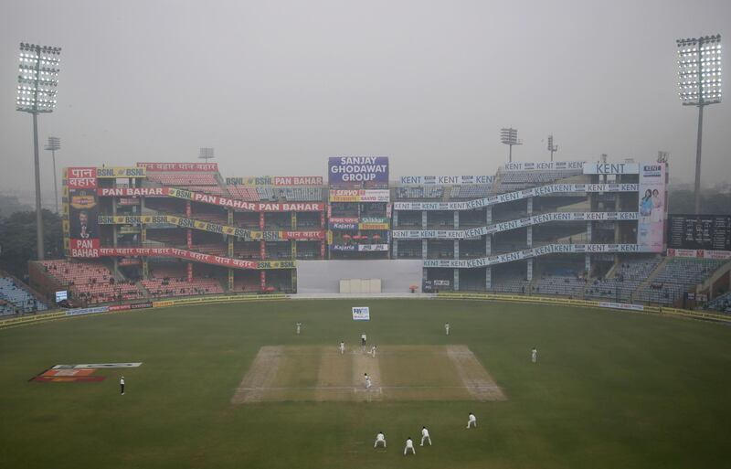 Floodlights are on as the fog envelops Ferozshah Kotla ground during the fourth day of third test cricket match between India and Sri Lanka in New Delhi, India, on Tuesday, December 5, 2017. Altaf Qadri / AP Photo