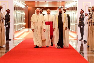 Pope Francis is welcomed by Abu Dhabi's Crown Prince Sheikh Mohammed bin Zayed upon his arrival at Abu Dhabi International Airport. AFP
