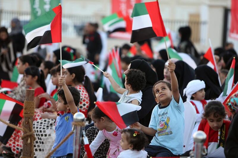 Children take part in the 44th UAE National Day celebrations in Ajman in December 2015. Pawan Singh / The National