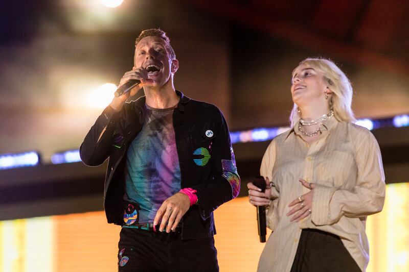 Chris Martin of Coldplay and Billie Eilish perform during the Global Citizen festival on Saturday in New York. AP