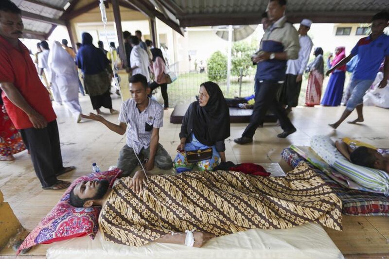 Patients are given medical treatment in the corridor of a hospital after the earthquake struck Pidie Jaya district. Hotli Simanjuntak / EPA