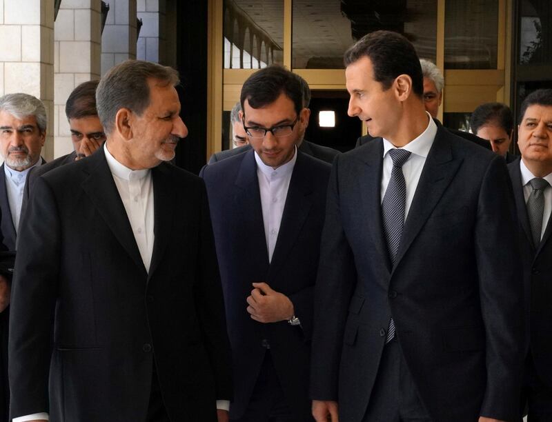 Iranian Vice President Eshaq Jahangiri meets with Syria's President Bashar al-Assad in Damascus, Syria in this handout released by SANA on January 29, 2019. SANA/Handout via REUTERS ATTENTION EDITORS - THIS IMAGE WAS PROVIDED BY A THIRD PARTY. REUTERS IS UNABLE TO INDEPENDENTLY VERIFY THIS IMAGE