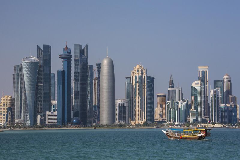 Middle East, Qatar, Doha City, View of West Bay Skyline with cityscape, boat floating on water in foreground (Photo by: JTB Photo/UIG via Getty Images) *** Local Caption ***  bz13ja-qatar-investments.jpg